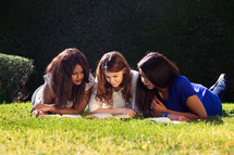 Three Girls Studying the Bible Together