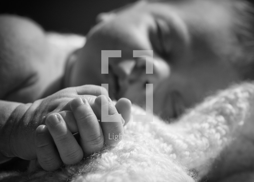 infant hands in prayer