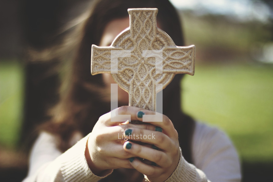 woman holding a cross 