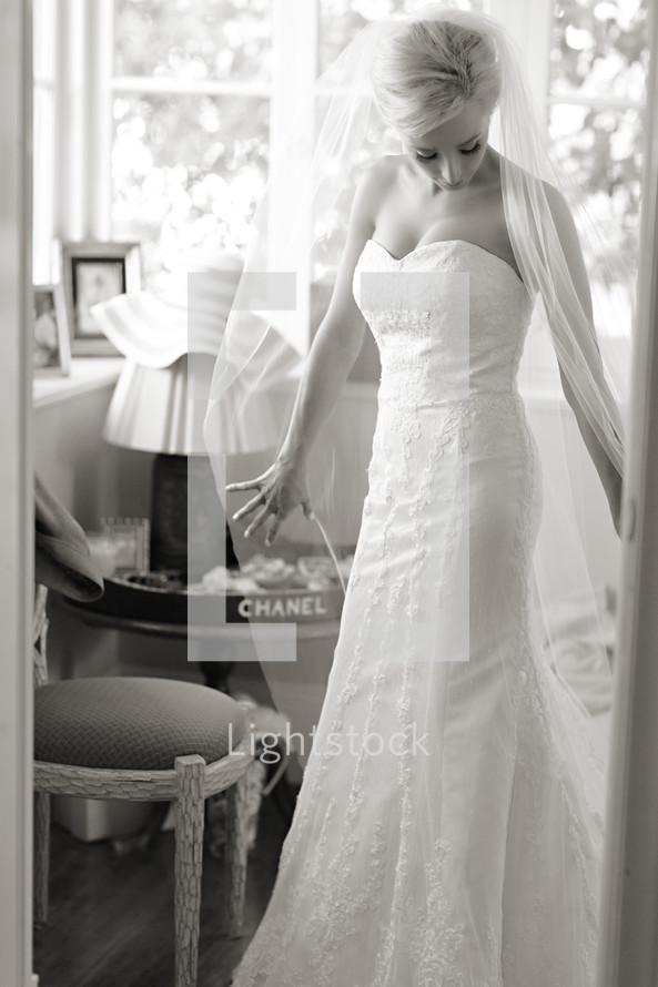 Bride wearing gown and veil preparing for marriage wedding  elegant