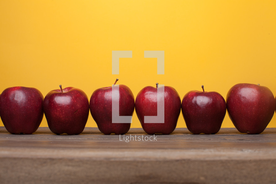 apples on a desk 