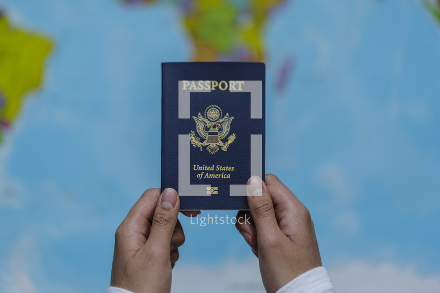 hands holding up a passport 