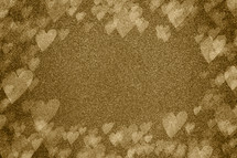gold sparkle background and bokeh hearts 