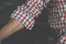 adventure tattoo on a forearm 