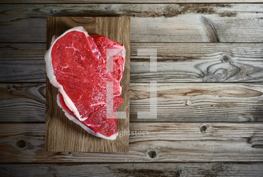 fresh meat fillet on wooden background