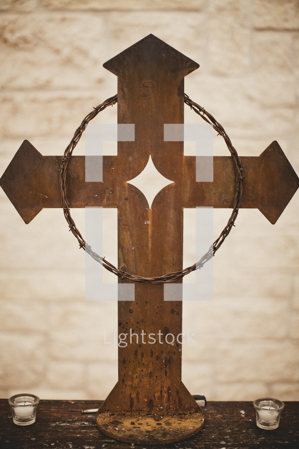 crown of thorns hanging on a cross