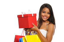 retail therapy - woman holding shopping bags and gift box 