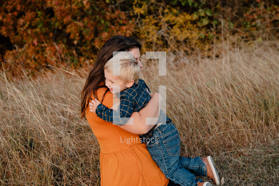 hug between a mother and toddler son
