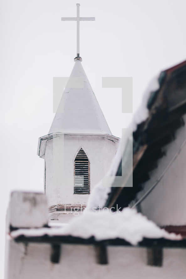 snow on a church steeple 
