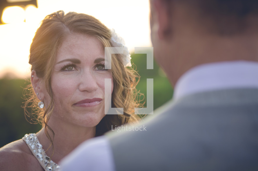 a bride looking at her groom 