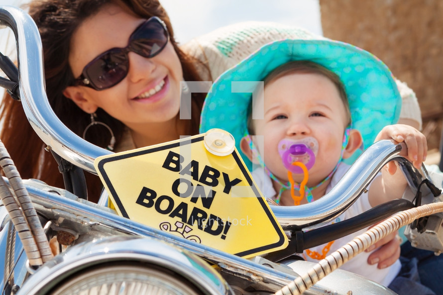 baby on board sign on a bicycle 