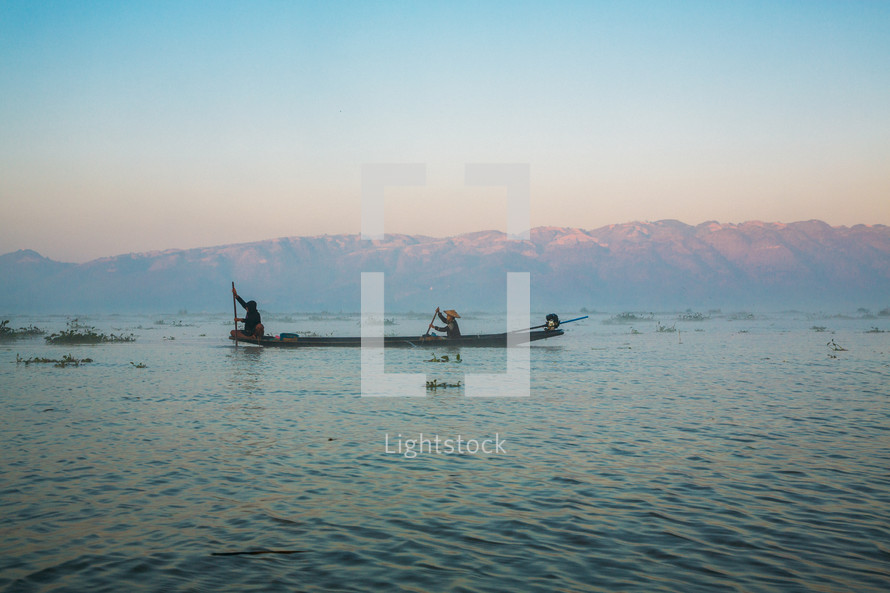 two fishermen on Inle Lake Mynamar at sunrise