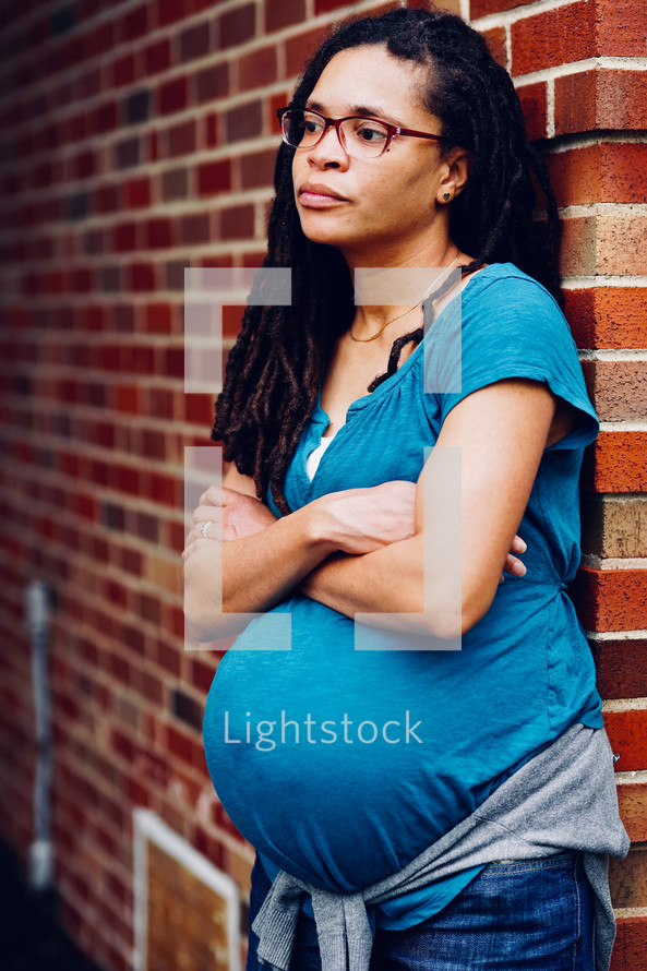 Pregnant African-American Woman contemplating a desicion 