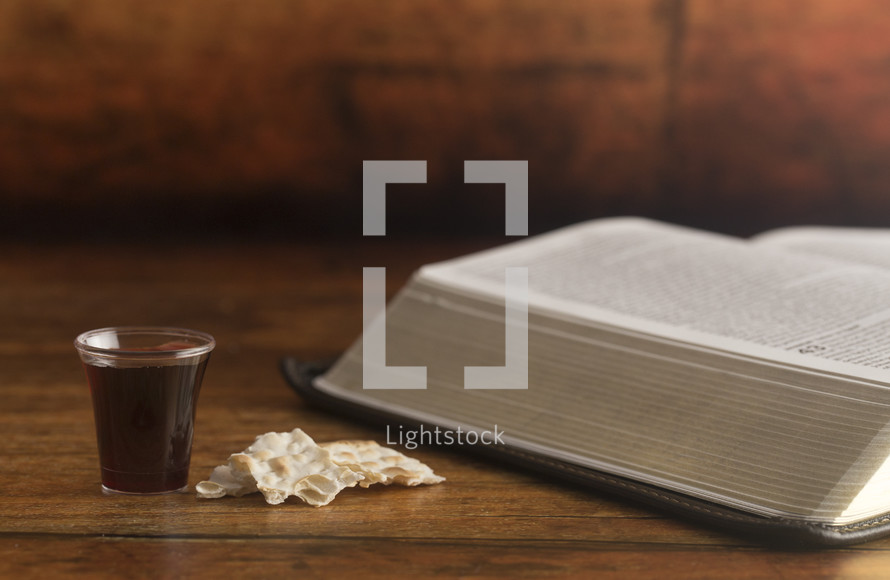 communion elements and an open Bible 