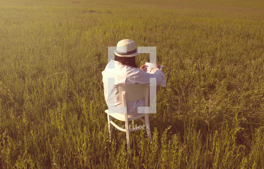 a woman sketching in a field 