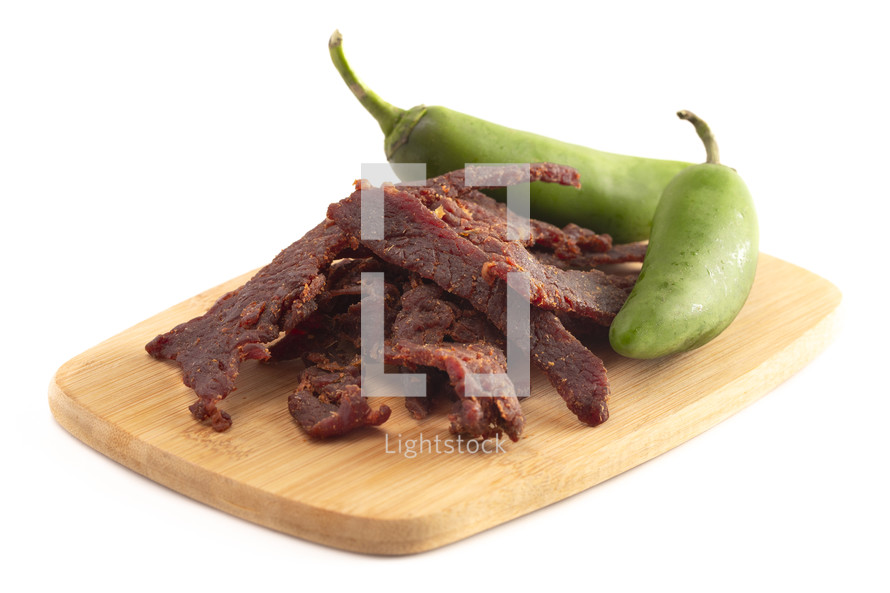 beef jerky and Fresh Jalapeno Isolated on a White Background
