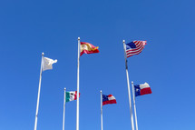 Flags on flagpoles in El Paso, Texas