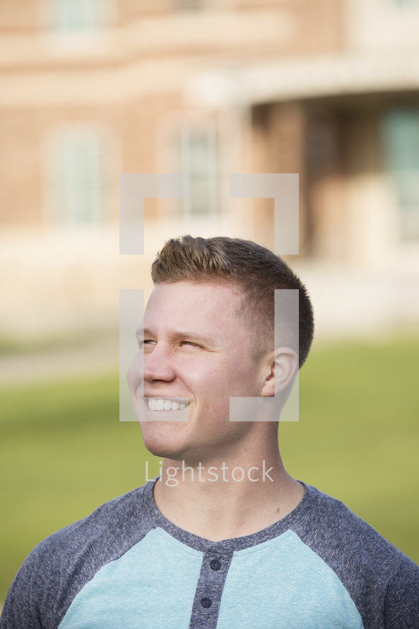 headshot of a smiling college student on campus 