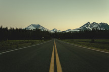 Yellow double line on an asphalt road | Depth | Perspective | Mountains | Early Morning 
