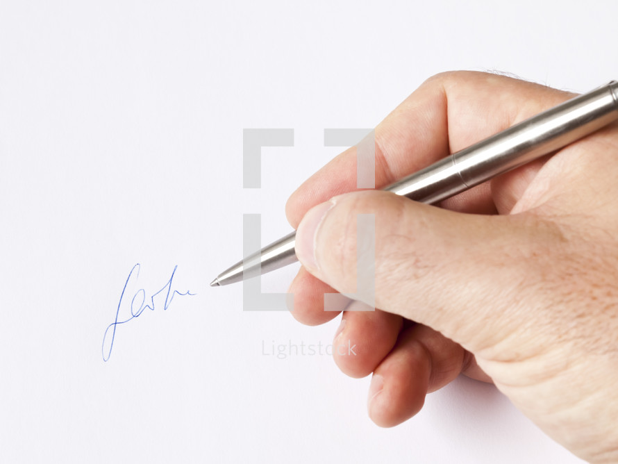 man signing with his signature 