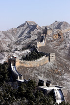 The Great Wall of China in mountains in the winter.