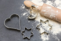rolling pin, cookie cutters, and flour 