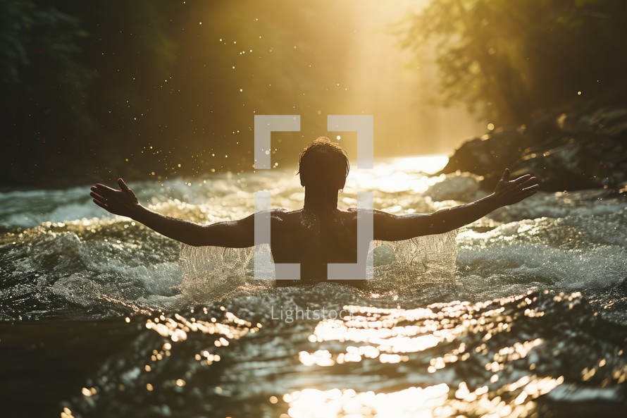 Man with arms outstretched in worship in a river. Beauty and power of Faith. Christian concept.	