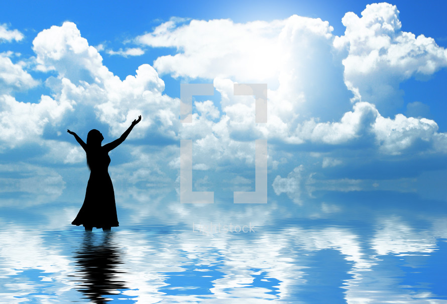 Silhouette of woman praising god in cloudy water. — Photo — Lightstock