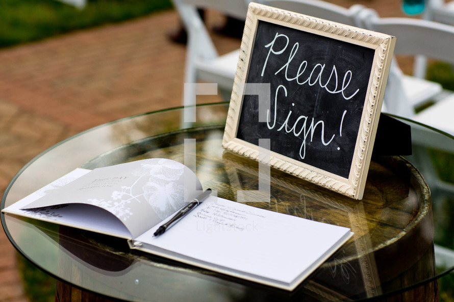A wedding book on a sign-in table at a wedding.