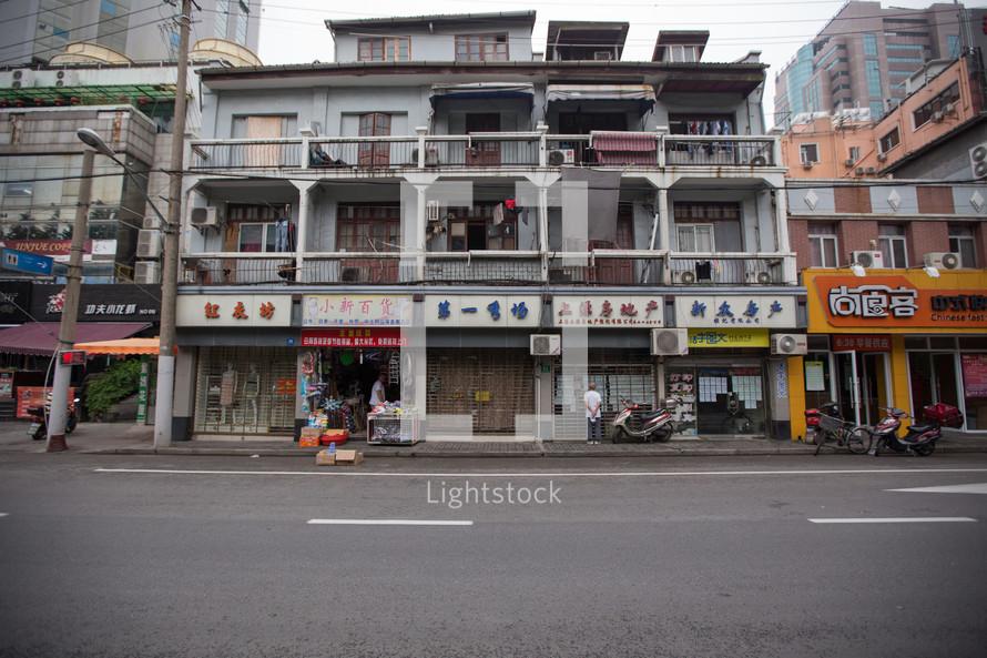 shops and apartments on a street in China 
