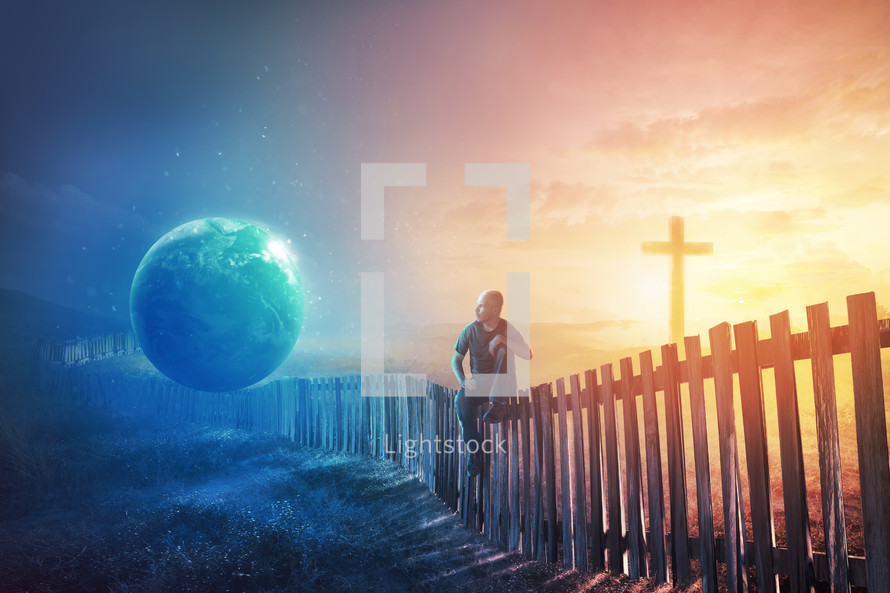 A man sits on a fence undecided between the earth and the cross.