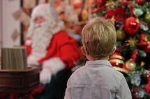 A Boy with Cochlear Implants and Santa Claus in Studio