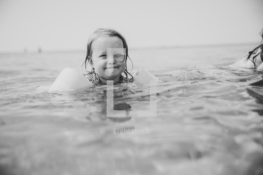 kids swimming in the ocean 