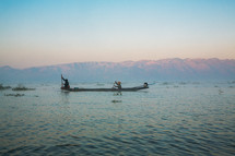 two fishermen on Inle Lake Mynamar at sunrise