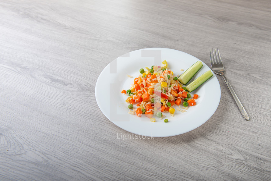 Hawaiian vegetable mix on light wooden table with copy space