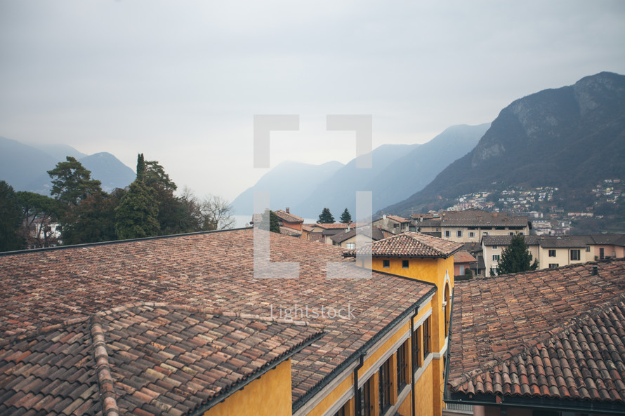 tile roofs and view of a coastal European town 