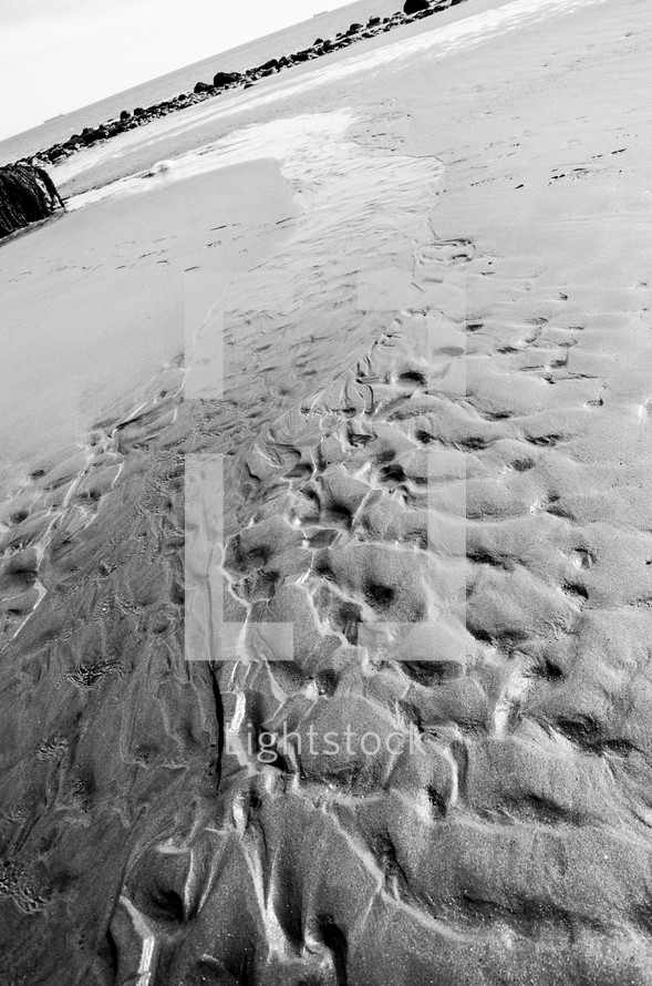 washed away sand on a beach