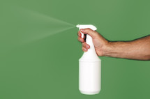 spraying a spray bottle 