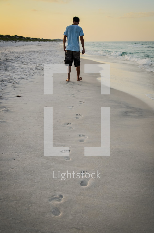 man walking on a beach