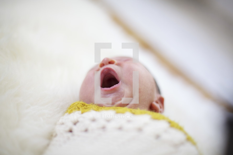 yawning infant 