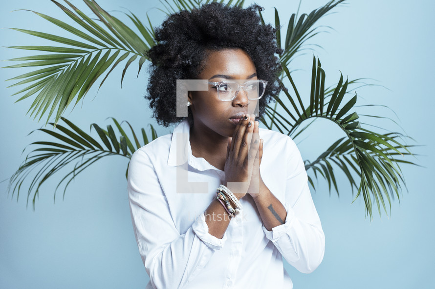 young African American female model with praying hands 