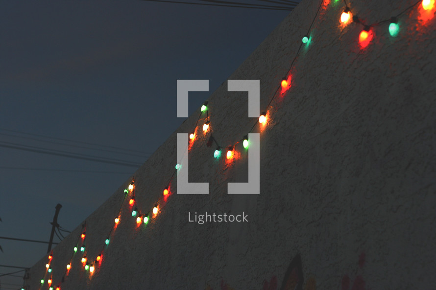 Christmas lights on the side of a wall 