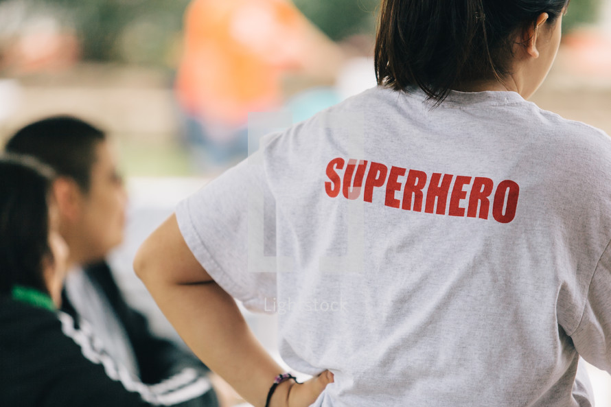 woman with the words superhero on her t-shirt 