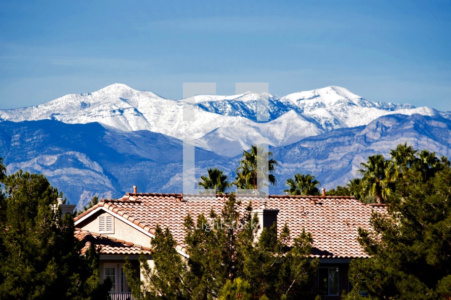 snow capped mountains over tile roofs in Las Vegas