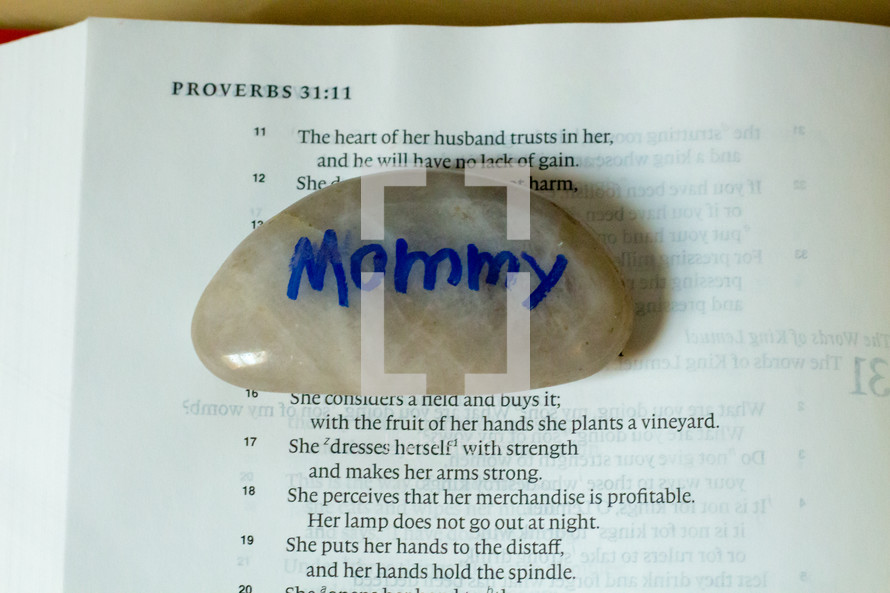 mommy stone on the pages of a Bible 