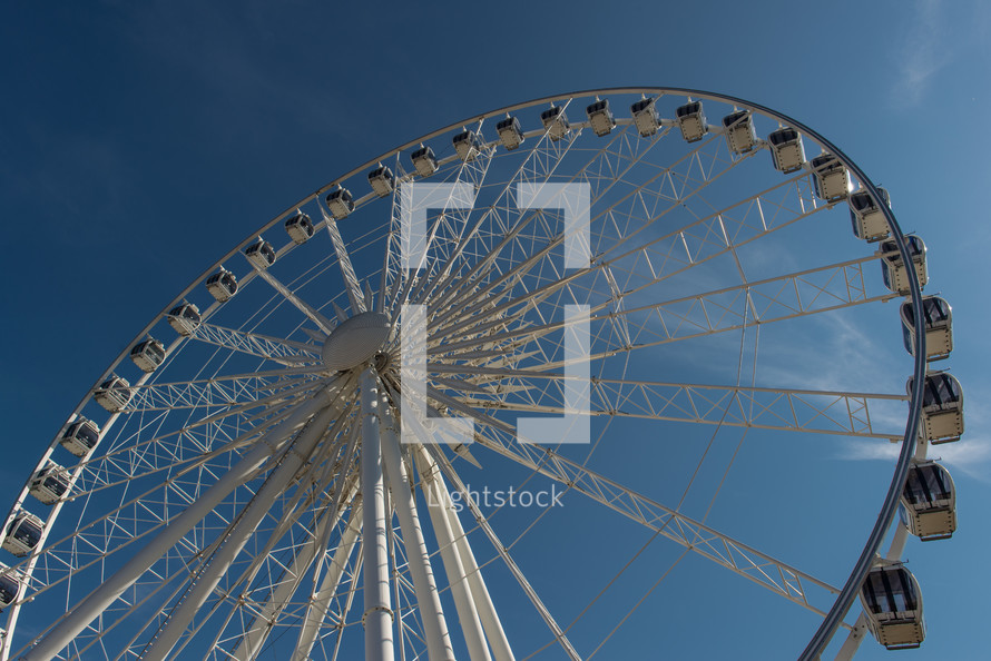 ferris wheel in a blue sky 