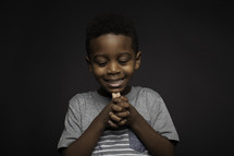 a boy child praying 