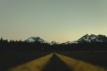 Yellow double line on an asphalt road | Depth | Perspective | Mountains | Early Morning
