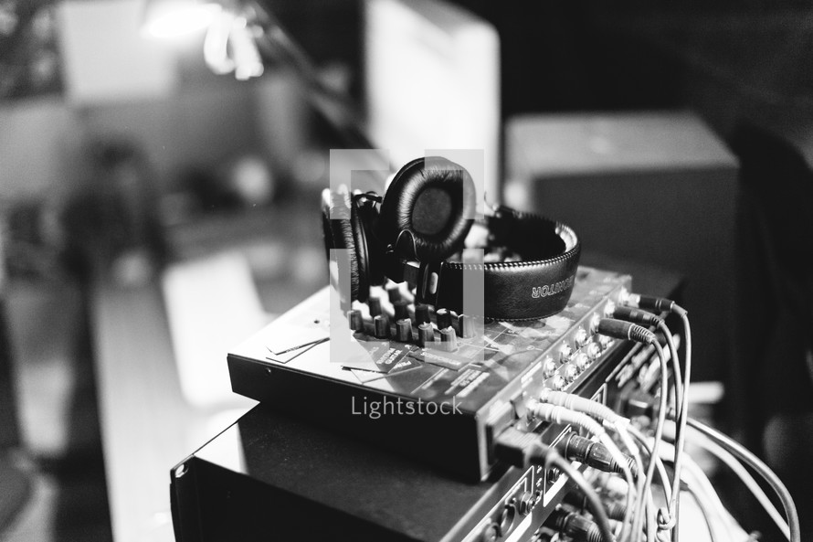 headphones on sound production equipment 