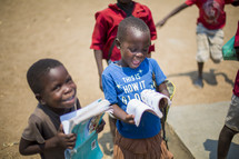 excited children holding children's Bibles 